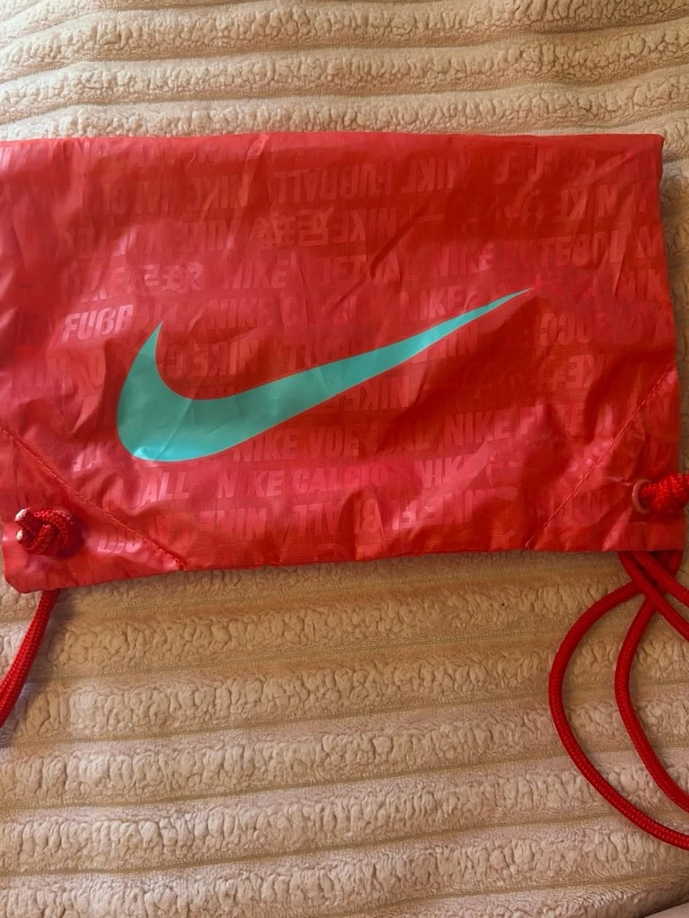 Nike Women's Pink Soccer Cleats with Teal Swoosh